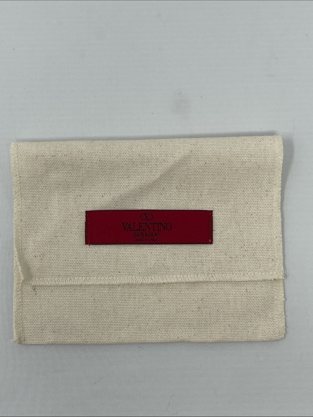 Valentino Garavani Cream Canvas dust bag with Red Logo